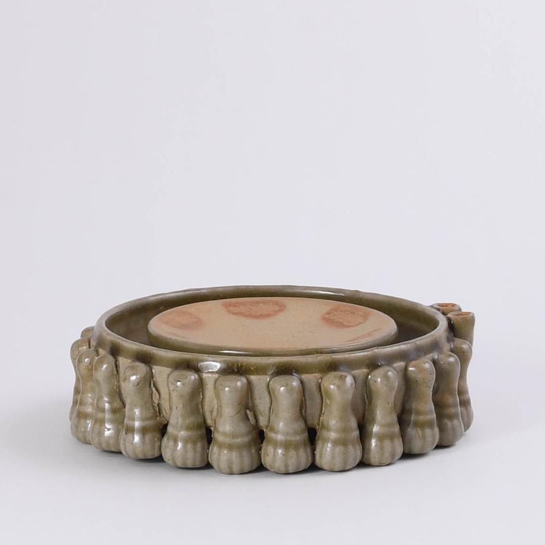 A 'YUE' CELADON MYRIAPOD INKSTONE: A 'YUE' CELADON MYRIAPOD INKSTONE SIZE:Dia:16.9cm,H:4.7cm