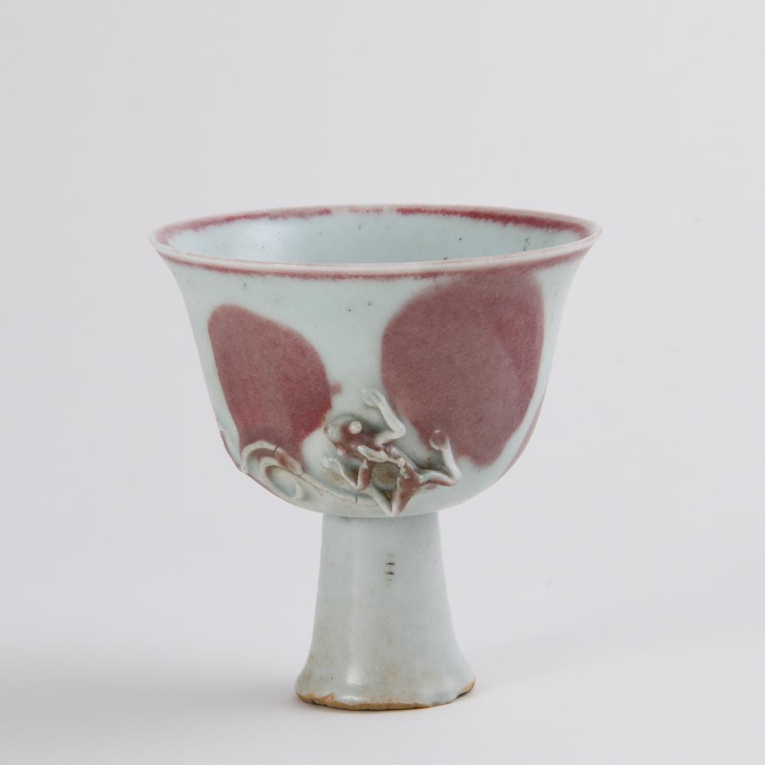 AN UNUSUAL UNDERGLAZE-RED 'CHILONG' ROTATING STEM CUP (1 of 7)