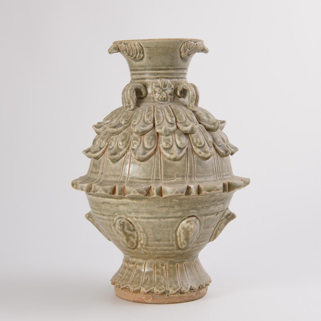 A FINE AND RARE MOLDED 'YUE' CELADON-GLAZED 'LOTUS' (1 of 7)