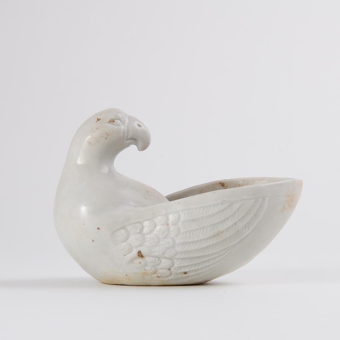 A 'XING' 'PARROT'-SHAPED CUP: A 'XING' 'PARROT'-SHAPED CUP SIZE:L:12.6cm,W:6.8cm,H:8.8cm
