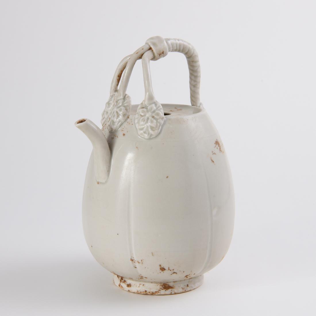 A 'DING' WHITE-GLAZED EWER (1 of 7)