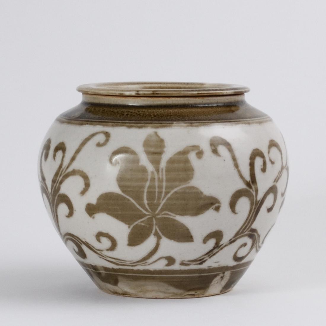 A RARE 'DING' SLIP-DECORATED 'LOTUS' JAR AND COVER (1 of 6)