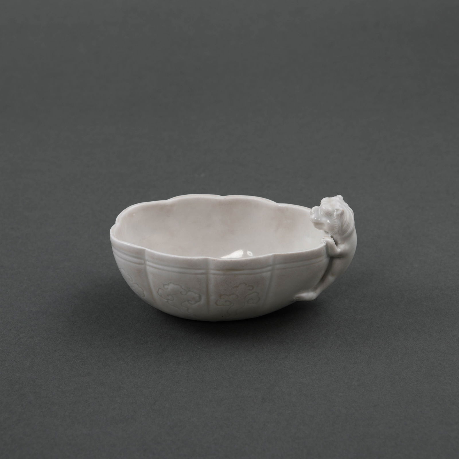 A LOBED WHITE 'DING' 'BEAST' CUP: A LOBED WHITE 'DING' 'BEAST' CUP L:11.9cm,W:7.4cm,H:5.8cm