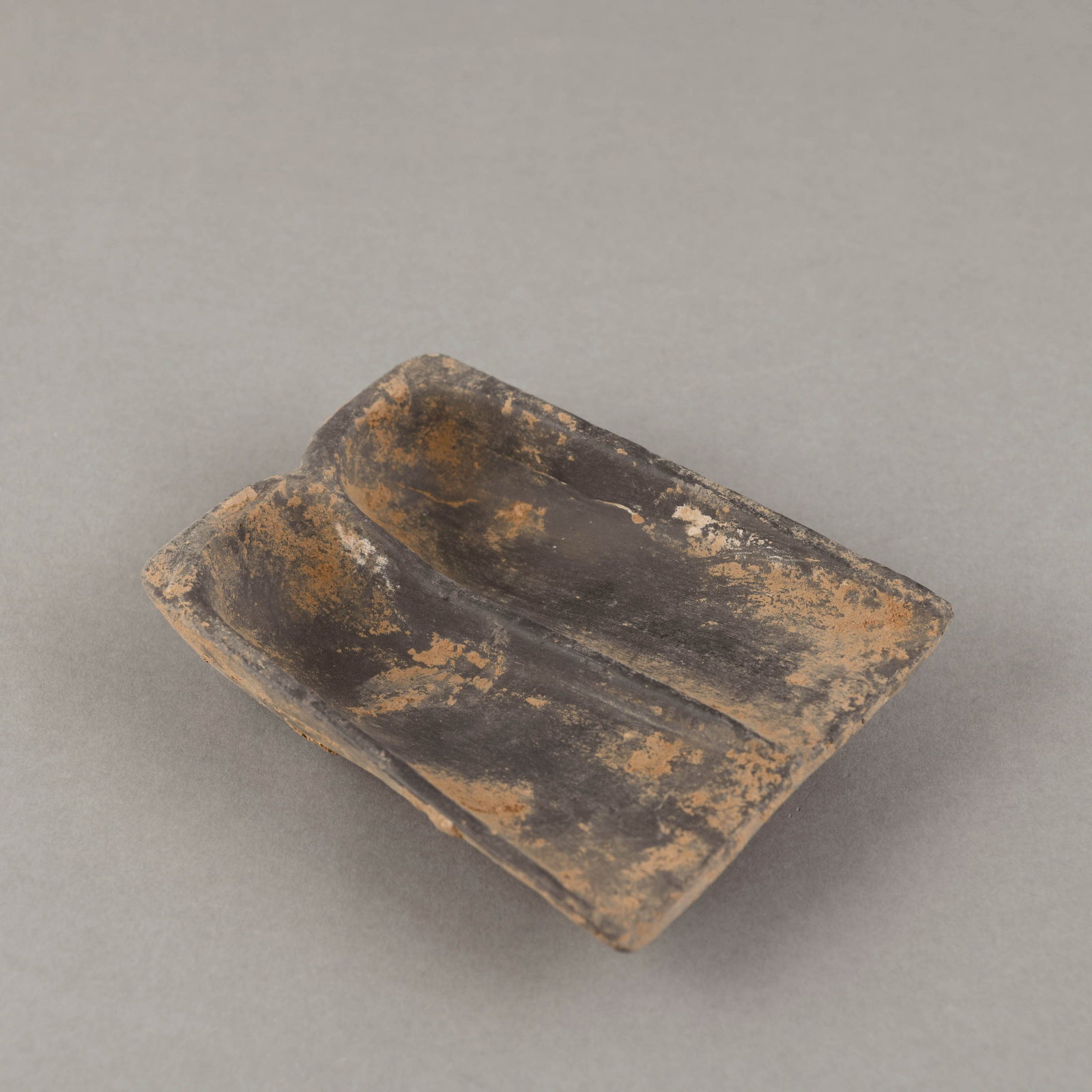 A POTTERY 'SHOVEL' INKSTONE (1 of 8)