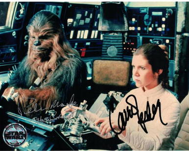 "STAR WARS: New Hope" - Carrie Fisher & Peter Mayhew: 100% In-Person. Signed scene photo in the legendary 'Millenium Falcon' from the original, "Star Wars: A New Hope" by Peter Mayhew as 'Chewbacca' and the late Carrie Fisher (Oct. 21, 1956 - Dec. 27,