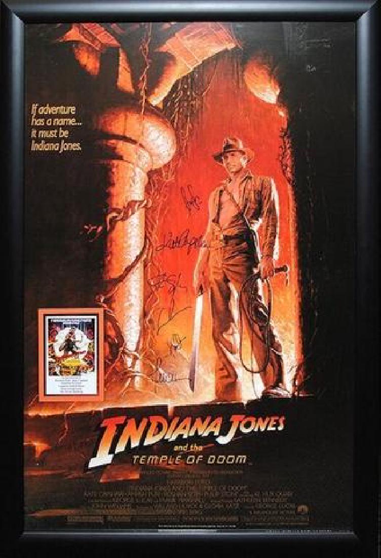 Indiana Jones and the Temple of Doom - Signed Movie: Signed by Harrison Ford, Kate Capshaw, Key Huy Quan, composer John Williams, producer George Lucas and director Steven Spielberg High gloss stock paper in wood framing with UV protective acrylic glass