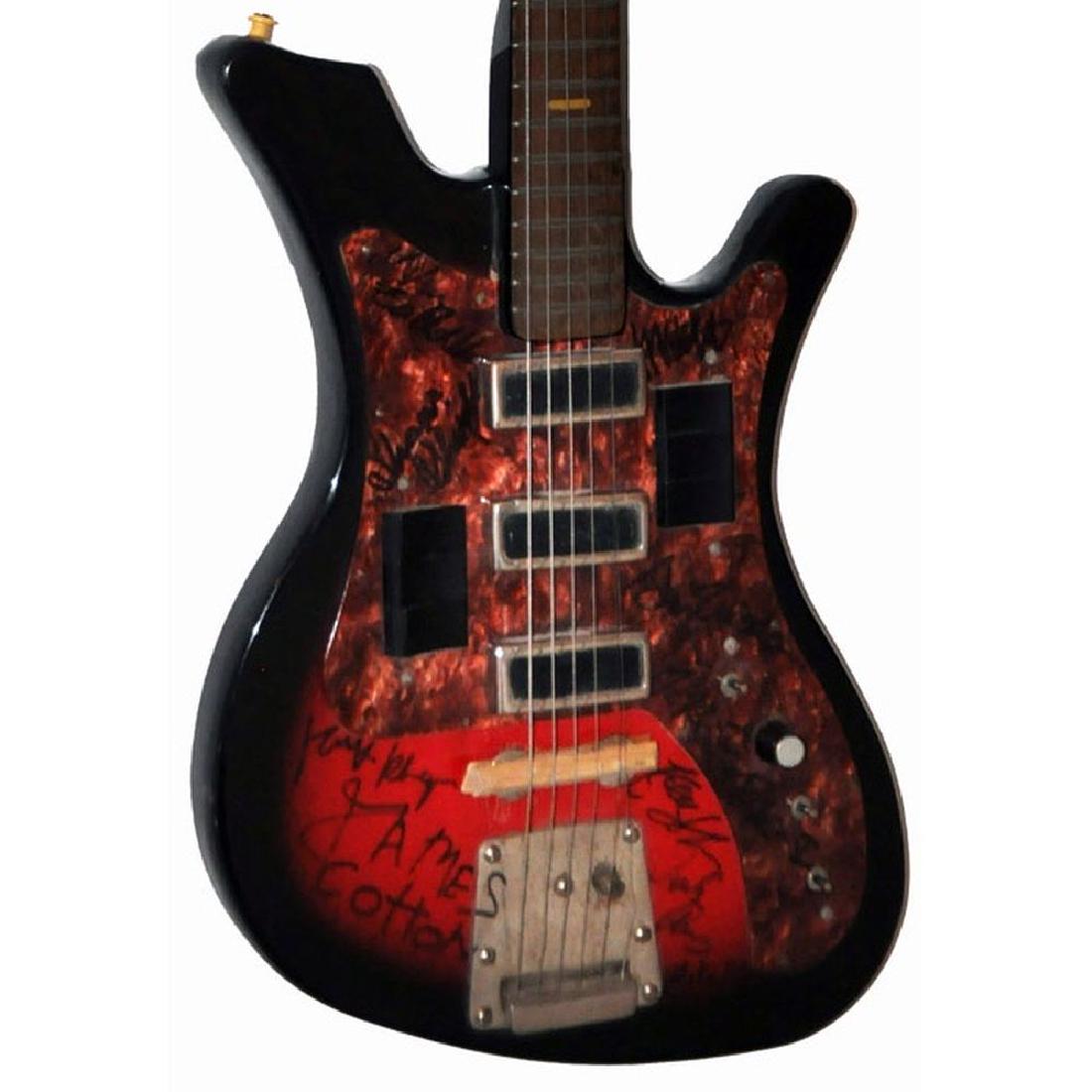 James Cotton and Band Signed Brown Pearly Pick Guard: Signed by James Cotton, Ken Johnson, Charles Calmese, Mike Zaltchik, Mike Bloomfield, Mark Klingman, Stu Woods, Todd Rundgren, Shavis Sheriff, and Matt Murray