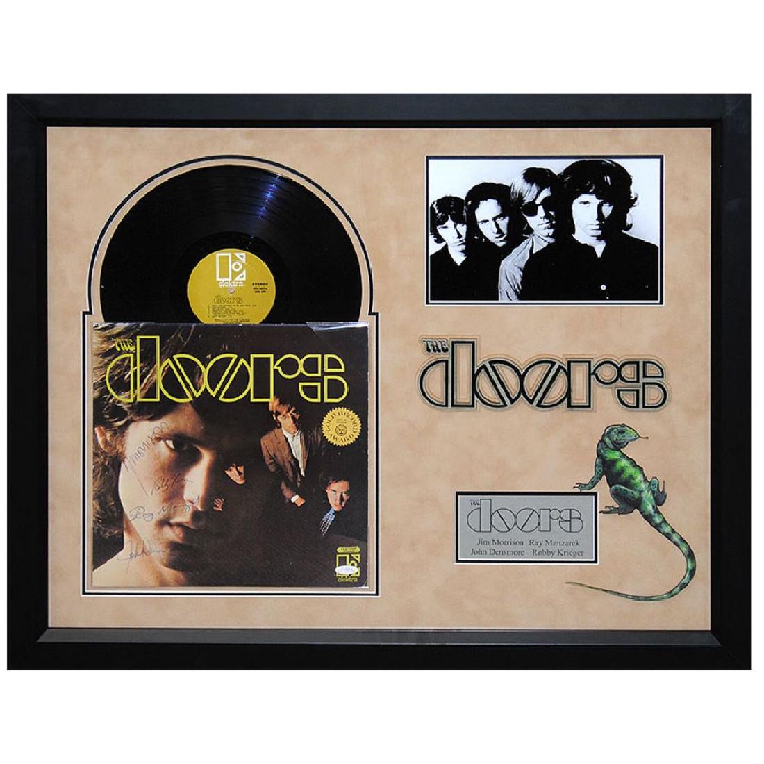 The Doors Signed and Framed Self-Titled Album: Signed by: Jim Morrison, Ray Manzarek, Robby Krieger, and John Densmore All autographed items come with a Lifetime Certificate of Authenticity with numbered tamper-proof decal. Actual guitar, signatur