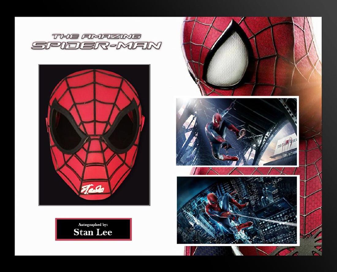 Spiderman Framed Signed Spiderman Mask: Signed Spiderman Mask Collage. Collage features a rare signed mask autographed by Stan Lee. Bitten by a radioactive spider, high school student Peter Parker gained the speed, strength and powers of a