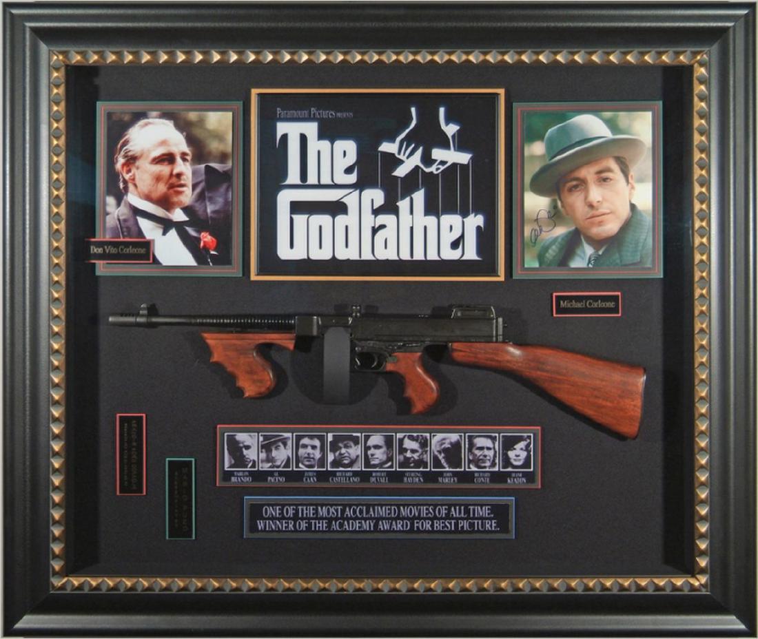 Brando & Pacino Signed Godfather Collage w/ Prop Gun: Signed by Marlon Brando and Al Pacino. Prop Tommy Gun
