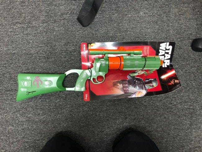 Jeremy Bulloch AKA Boba Fett Signed Prop Gun: Signed by Jeremy Bulloch. Signed on handle of prop gun with black marker. Comes with JSA Cert #WP859959. Item is approximately 26x9in