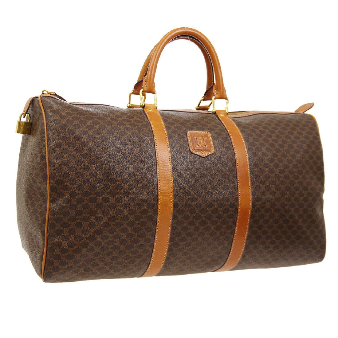 Vintage CELINE Macadam Travel Bag: Color:Brown Strap Drop:4.7 Style:Travel Hand Bag Depth:9.1 Height:11.0 Material: PVC, Leather Brand:CELINE Width:19.7 W 19.7 x H 11.0 x D 9.1 " Handle Drop. 4.7 " Bag in good condition. No obvious dam