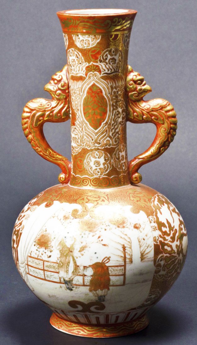 Red Kutani Double Dragon Handle Vase: Beautiful Kutani vase with double-dragon handle. Figure painting and floral pattern with Kaga-kuni Nishiki mark. Meiji period (1868 - 1912). 12 X 7dia.