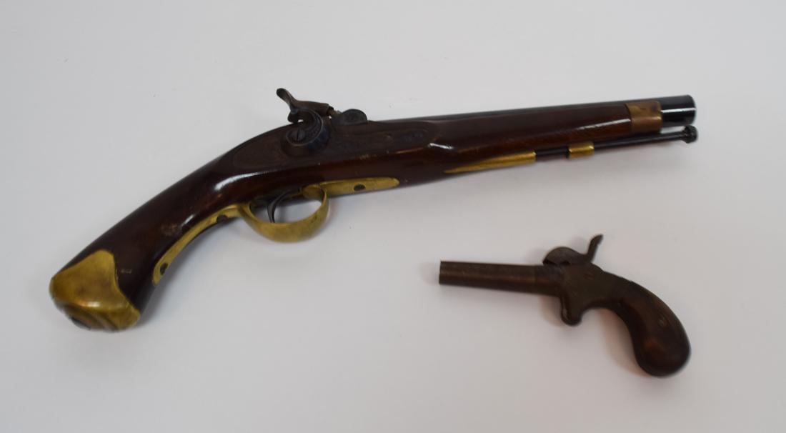 A.S.T Company Hero and Single Shot Pistol: 1868-1873 with Black powder Percussion Pistol 3" Iron Barrel Derringer stamped A.S.T. Co. Hero 5 1/2" overall made in Spain 045 Cal replica Percussion Pistol marked Spain on Barrel. 5000-0004-2
