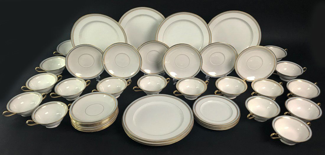 Lennox Double Handled Service Cups and Plates: Set of 17 double handled service (bouillon)cups with saucers (19) and 7 matching salad plates. All marked with Lennox seal, beautiful china with gold accents on rims and handles. All in good condition