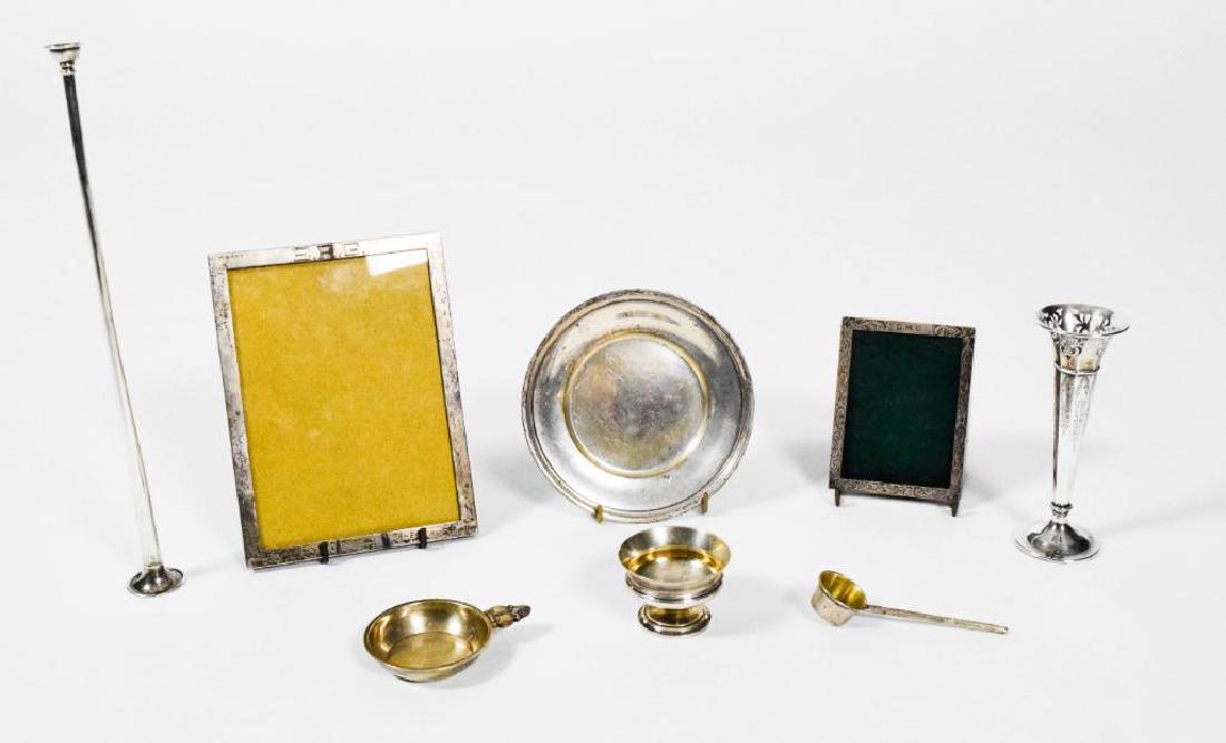 Eight Piece Sterling Lot: Lot of 8 19th-early 20th century disparate sterling pieces. Two picture frames, one candle stick, one cup, one wine cup, small ladle, and candle snuffer (13" tall), 14.722 ozt total.