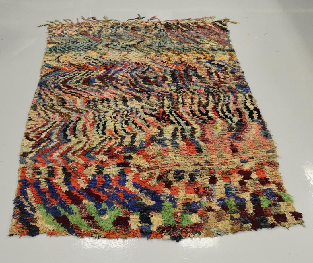 Moroccan Rag Rug: 20th Century Moroccan rag rug, composed of multi-colored scraps of "rags", featured in the "Post Punk Pink" exhibit at the Calvin Morris Gallery (NYC, 2010). 59" X 88"