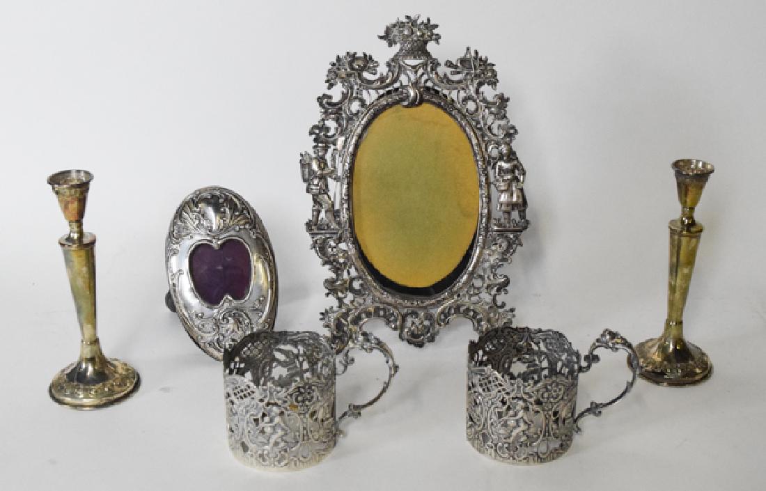 .800 Sterling Silver frames, candlesticks & cup holders: Two picture frames, Pair of candlesticks, two Russian cup holders. Tallest 10"