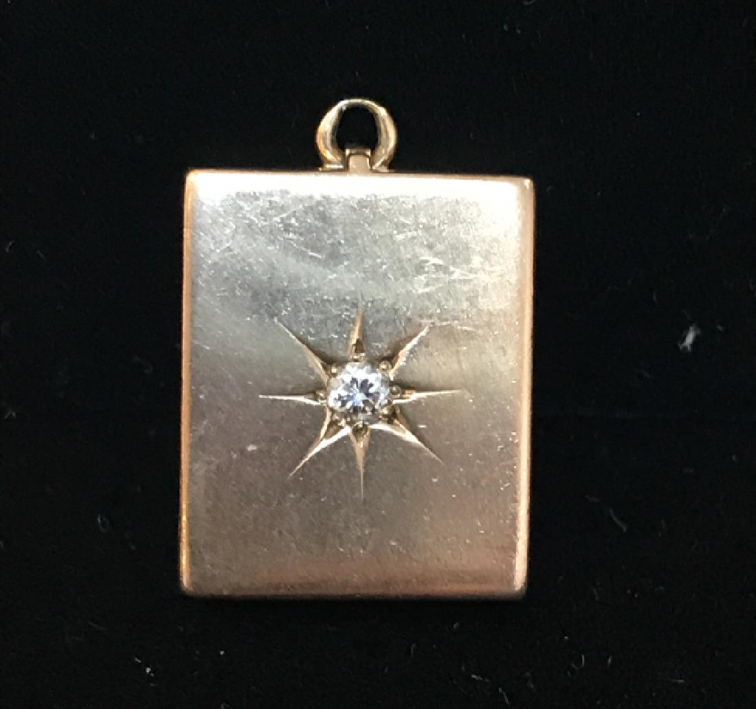 14 K Yellow Gold Diamond Set Antique Locket: Antique, tested 14 Karat yellow gold, double frame, rectangular locket. The front features an incised 8 point star design into which a .11ct brilliant round cut diamond, 3mm, sits in a bead setting. M
