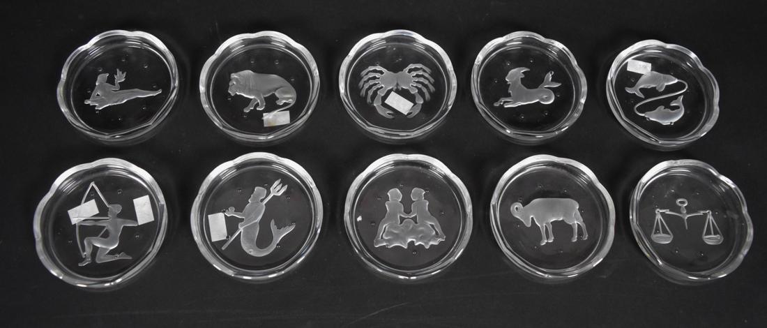 10 Val Saint Lambert Zodiac Coasters: 10 Val Saint Lambert crystal zodiac coasters. Missing Taurus and Scorpio. Diameter 3.5"