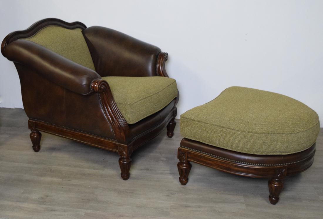 Thomasville Chair and Ottoman: Green fabric back and seat with leather accent arms. Wood scroll arms, crest and legs. Foot stool has green upholstery on leather and wood base. Chair is 44" wide 40" high 41" deep