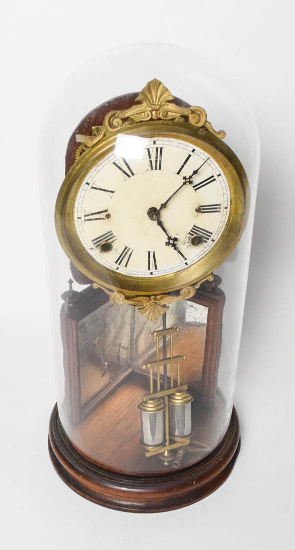 Ansonia Crystal Palace Clock Under Dome: Ansonia Crystal Palace clock, unmarked dial, two-cylinder pendulum marked "Davies Pat.", clockworks marked "Ansonia clock Co Ansonia Conn. U.S.A." gilt metal frame around dial marked "Pat. May 10 59",