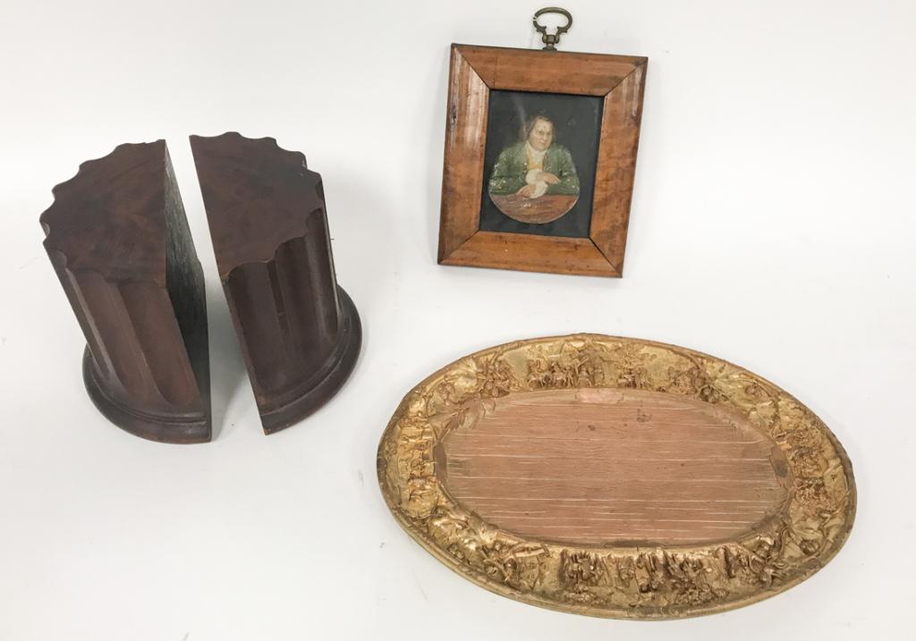 Wood and Metal Table Articles: Pair wooden column bookends, Arts and Crafts metal tray marked Cowan Chicago, framed wooden portrait plaque Dr. Johnson