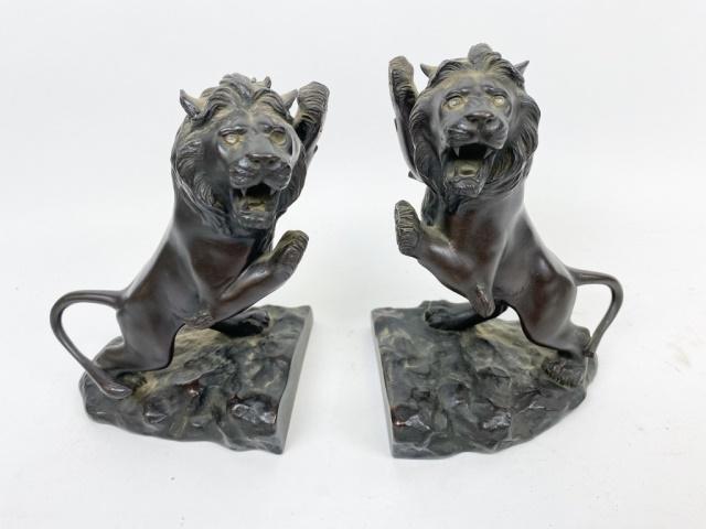 Japanese Bronze Lion Bookends: Meiji Period. Lions have glass eyes. Character stamp on front of both bases. 8" Tall