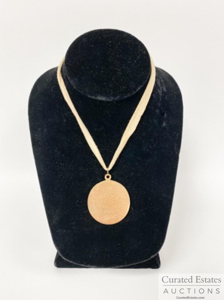 Elaine's Oklahoma Medal from Richard Rodgers 14k Gold: Large 14k gold pendant marked "Cartier" presented to Elaine Scott by Richard Rodgers for her efforts as the Broadway stage manager for the initial production of Oklahoma 1943-1948. 11.8 dwtBears an en