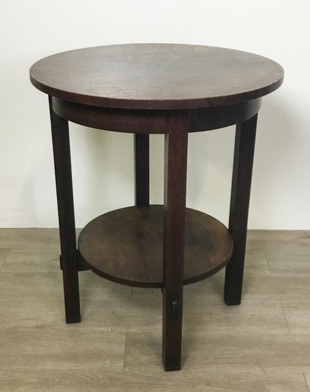 L&JG Stickley #540 Lamp Table: Arts and Crafts. Oak with dark stain. Shelf on top of stretchers. Stretchers have through tenons with legs. 29" High 24" Diameter