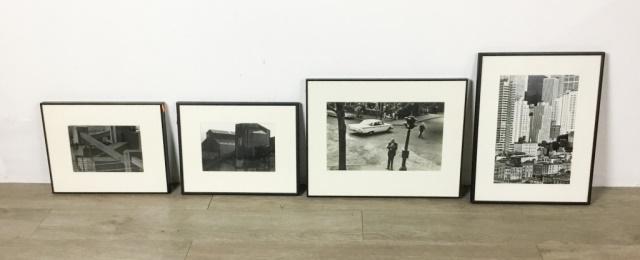 4 Black & White Photos by Victor Edelstein: Man smoking 8" x 13 3/4", 2 buildings each 5 3/4" x 8 3/4", cityscape 12 1/4" x 8 1/2"