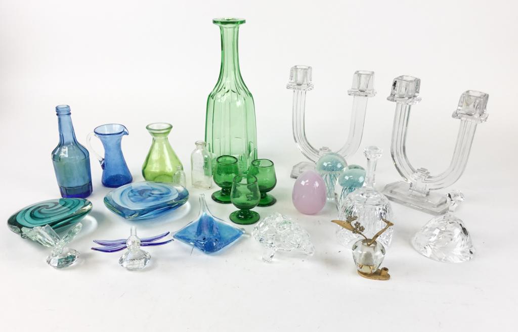 Decorative Glass Grouping: Green vase, blue crackle pitcher, blue bottle (no top), miniature bottle with dog decoration, Effanbee bottle, 4 green cordials, green decanter (no stopper), 2 bells, pair of candlesticks, crystal tur