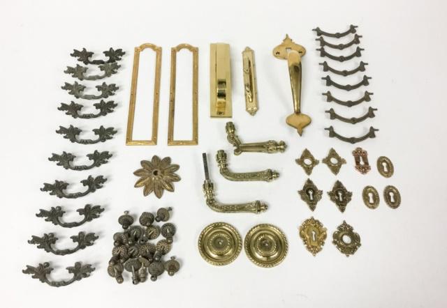 Gilt Bronze Door Hardware: Large group of gilt bronze hardware. Drawer pulls, door handles, escutcheons, strike plates