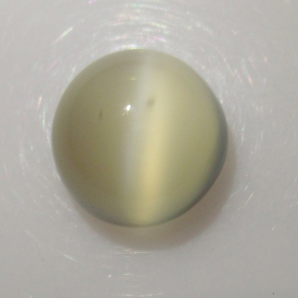 6.24 Ct Natural White Moonstone Catseye 11 mm: Weight - 6.24 Ct / Size - 11.10 x 11.00 x 7.10 mm / Shape - Round Cabochon / Color - White / Clarity - Transparent / Origin - India / Treatment - None
