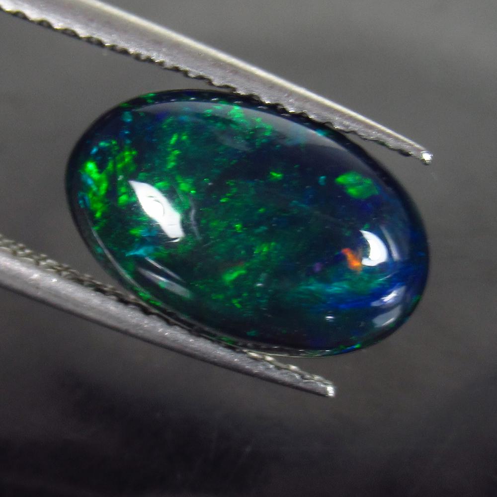 1.98 Ct Natural Ethiopian Fire Black Opal Oval Cab: Weight - 1.98 Ct / Size - 12.60 x 8.10 x 4.10 mm / Shape - Nice Oval Cabochon / Color - Black / Clarity - Obaque / Origin - Ethiopia / Treatment - Heated