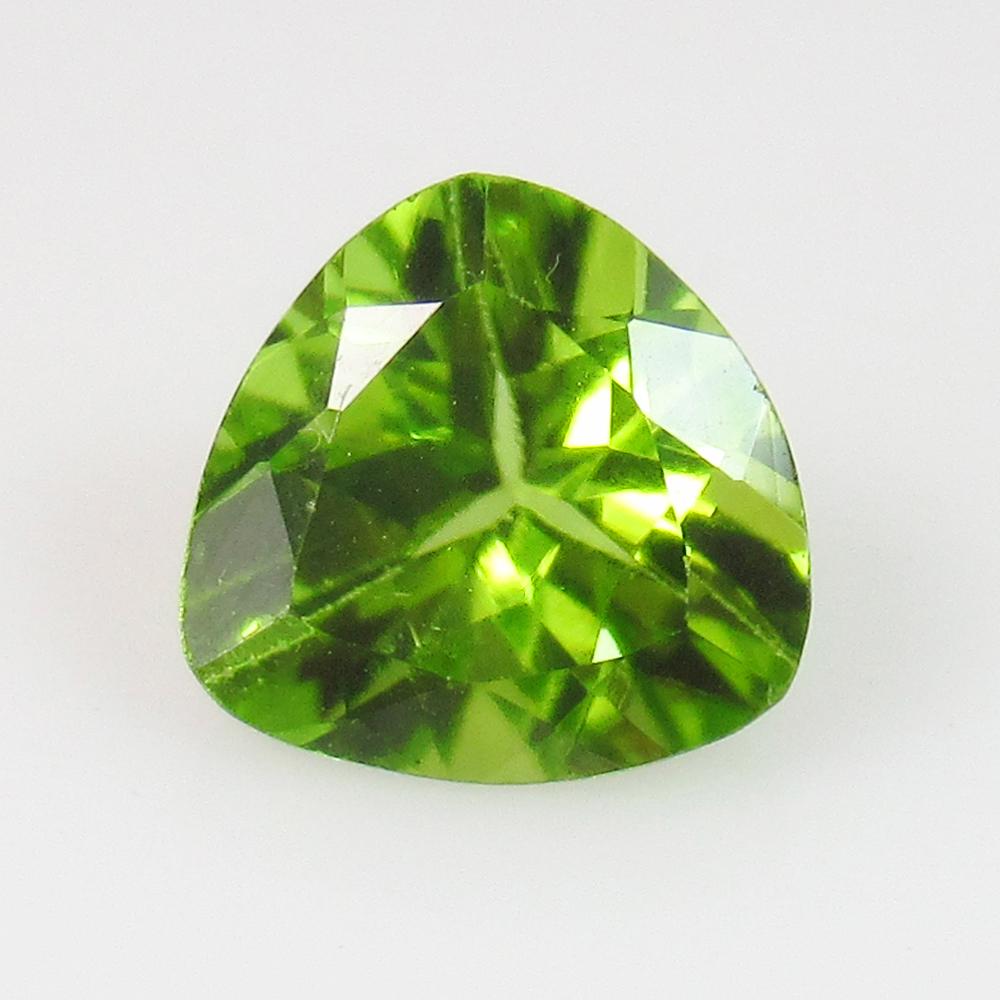 1.39 Ct Natural Pakistan Peridot Trillion Cut: Weight - 1.39 Ct / Size - 7.00 x 7.20 x 4.60 mm / Shape - Trillion Cut / Color - Green / Clarity - VVS / Origin - Pakistan / Treatment - None