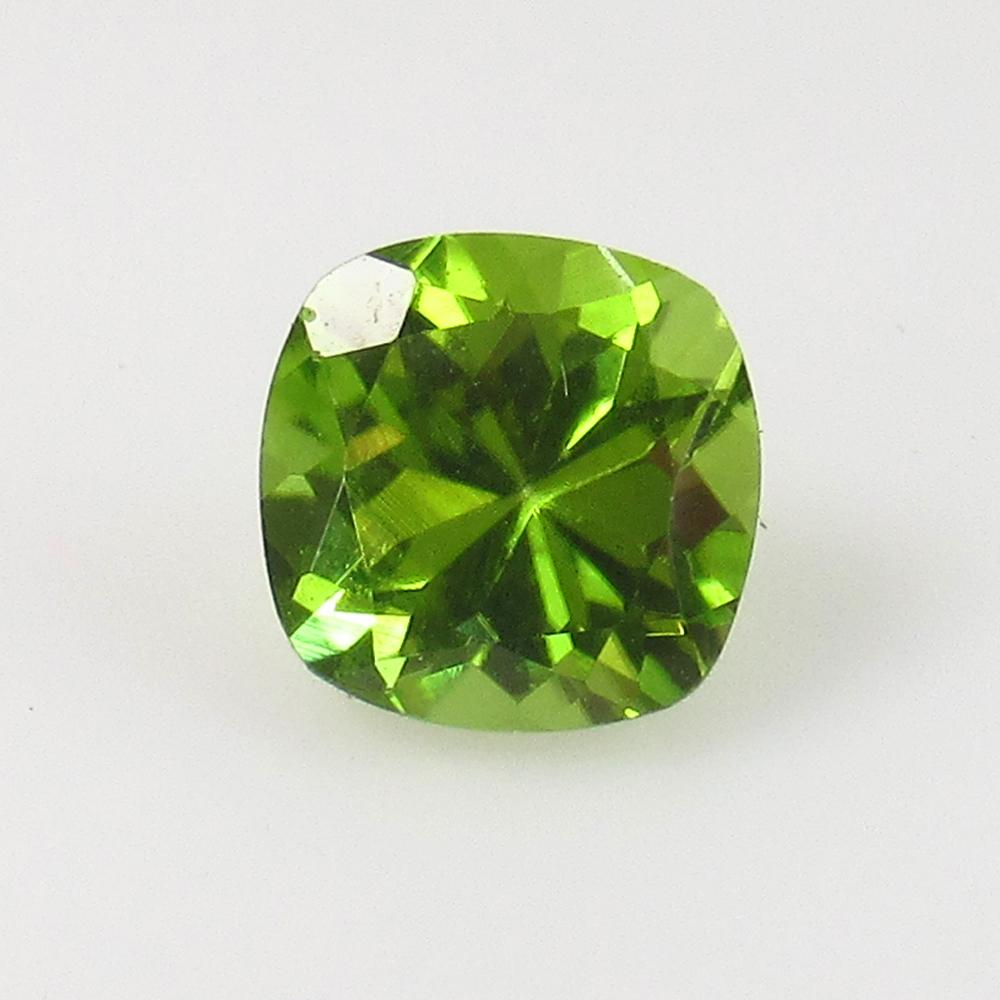 1.62 Ct Natural Pakistan Peridot Cushion Cut: Weight - 1.62 Ct / Size - 7.00 x 7.00 x 5.00 mm / Shape - Cushion Cut / Color - Green / Clarity - VVS / Origin - Pakistan / Treatment - None