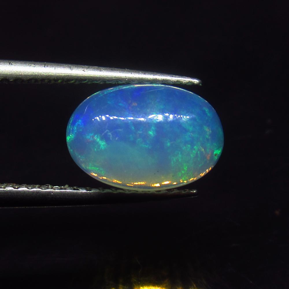 1.60 Ct Natural Multi-Color Welo Opal: Weight - 1.60 Ct / Size - 10.50 x 7.30 x 4.00 mm / Shape - Oval Cabochon / Color - Multicolor / Clarity - Translucent / Origin - Ethiopia / Treatment - None