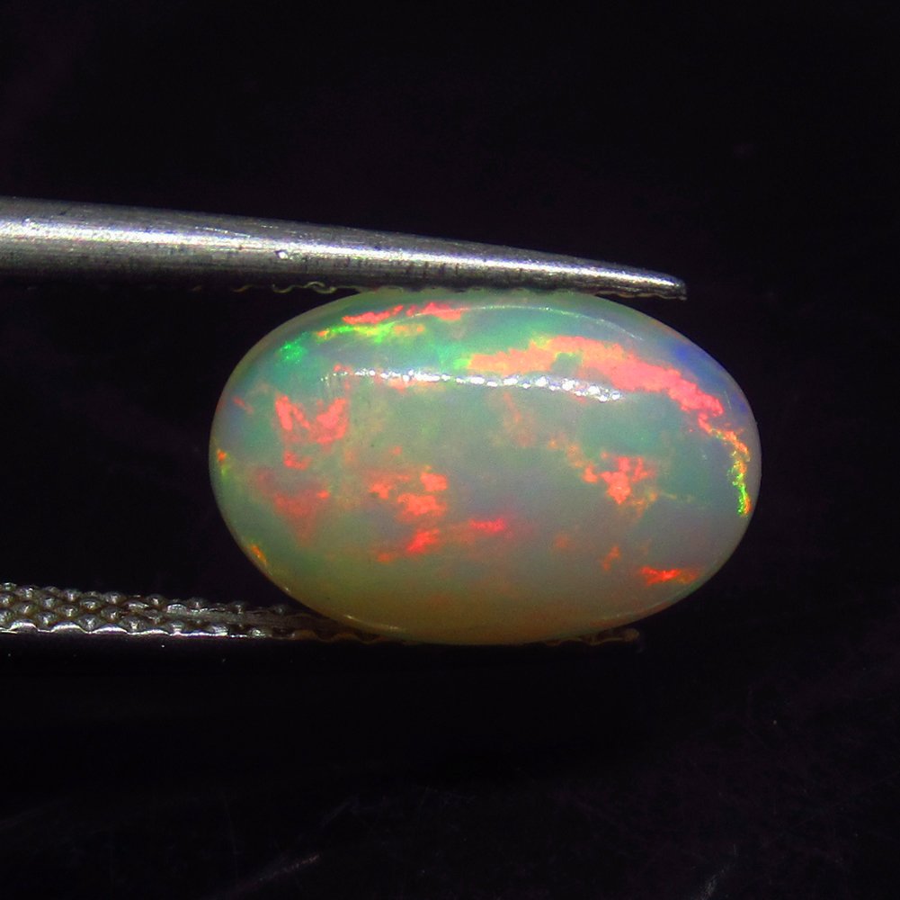 1.64 Ct Natural Multi-Color Welo Opal: Weight - 1.64 Ct / Size - 11.00 x 7.50 x 4.30 mm / Shape - Oval Cabochon / Color - Multicolor / Clarity - Translucent / Origin - Ethiopia / Treatment - None