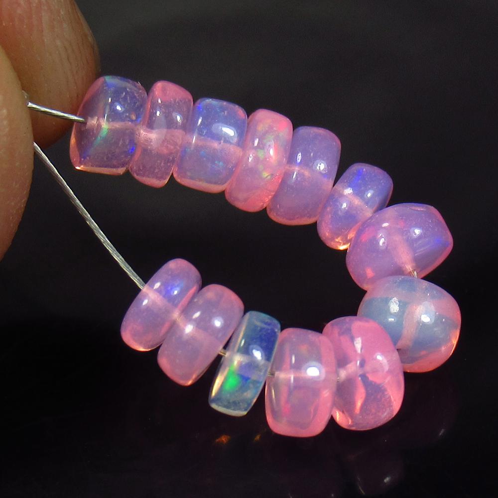 5.00 Ct Natural 13 Drilled Pink Fire Opal Beads: Weight - 5.00 Ct / Size - 5.10 to 5.60 mm / Pices - 13 No's / Shape - Round Beads / Color - Pink / Clarity - Transparent / Origin - Ethiopia / Treatment - Heated
