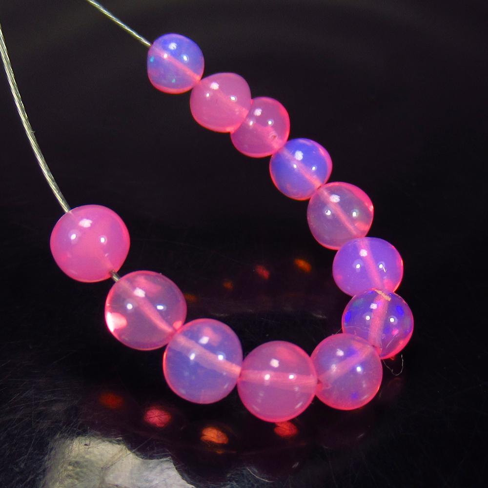 4.86 Ct Natural 12 Drilled Pink Fire Opal Beads: Weight - 4.86 Ct / Size - 4.10 - 4.80 mm / Pices - 12 No's / Shape - Round Ball Beads / Color - Pink / Clarity - Transparent / Origin - Ethiopia / Treatment - Heated