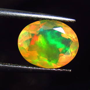 1.74 Ct Natural Multi-Color Opal Loose Stone: Weight - 1.74 Ct / Size - 10.00 x 7.80 x 5.50 mm / Shape - Oval Cut / Color - Multicolor / Clarity - Translucent / Origin - Ethiopia / Treatment - None