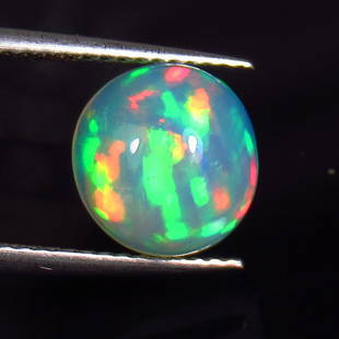 2.06 Ct Natural Multi-Color Opal Loose Stone: Weight - 2.06 Ct / Size - 9.40 x 9.20 x 5.30 mm / Shape - Round Cabochon / Color - Multicolor / Clarity - Translucent / Origin - Ethiopia / Treatment - None