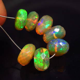 7.50 Ct Natural 7 Drilled Multi-color Fire Opal Loose Beads: Weight - 7.50 Ct / Size - 7.00 - 7.70 mm / Pieces - 7 No's / Shape - Faceted Round Beads / Color - Multicolor / Clarity - Transparent / Origin - Ethiopia / Treatment - None