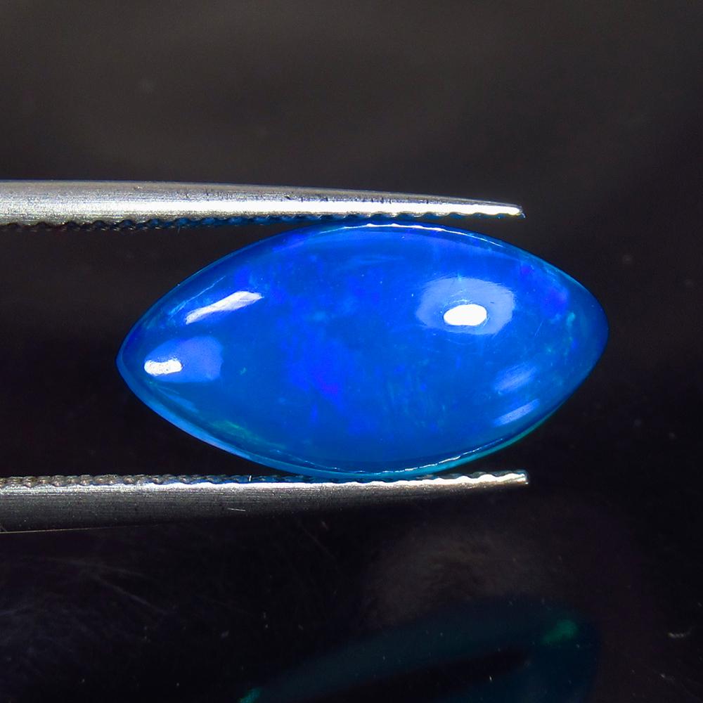 3.02 Ct Natural Blue Fire Opal Loose Stone: Weight - 3.02 Ct / Size - 16.00 x 8.50 x 5.30 mm / Shape - Marquise Cabochon / Color - Blue / Clarity - Transparent / Origin - Ethiopia / Treatment - Heated