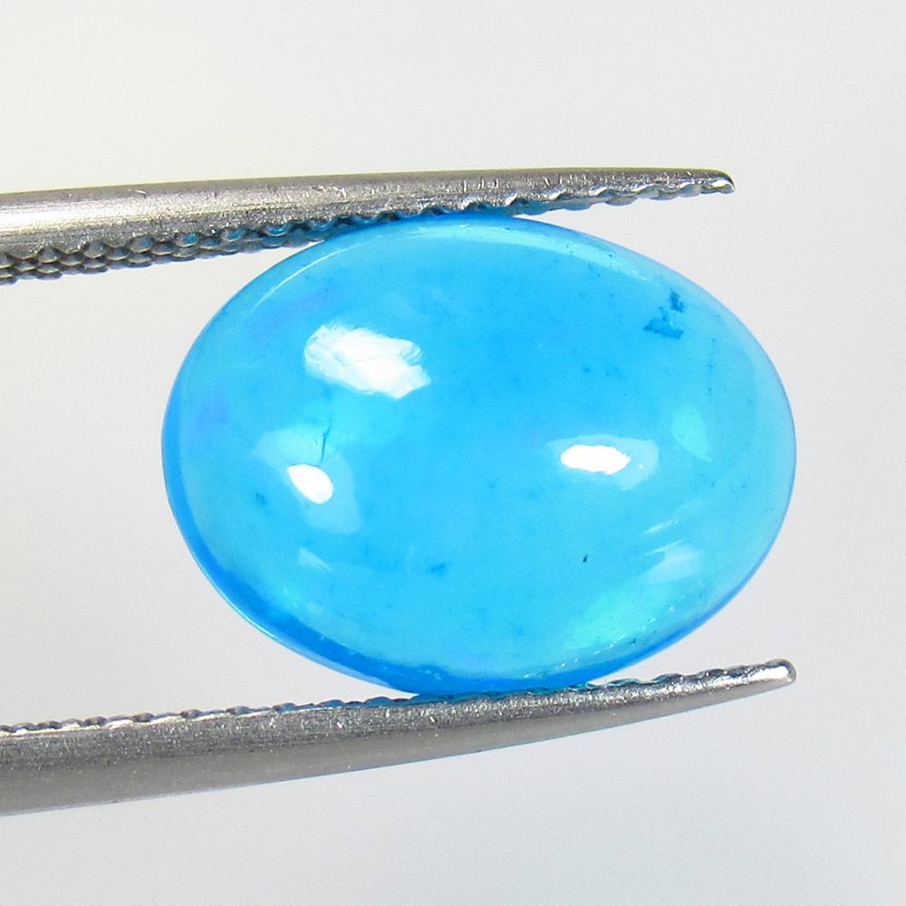 2.52 Ct Natural Blue Fire Opal Loose Stone: Weight - 2.52 Ct / Size - 12.10 x 9.30 x 5.30 mm / Shape - Oval Cabochon / Color - Blue / Clarity - Transparent / Origin - Ethiopia / Treatment - Heated