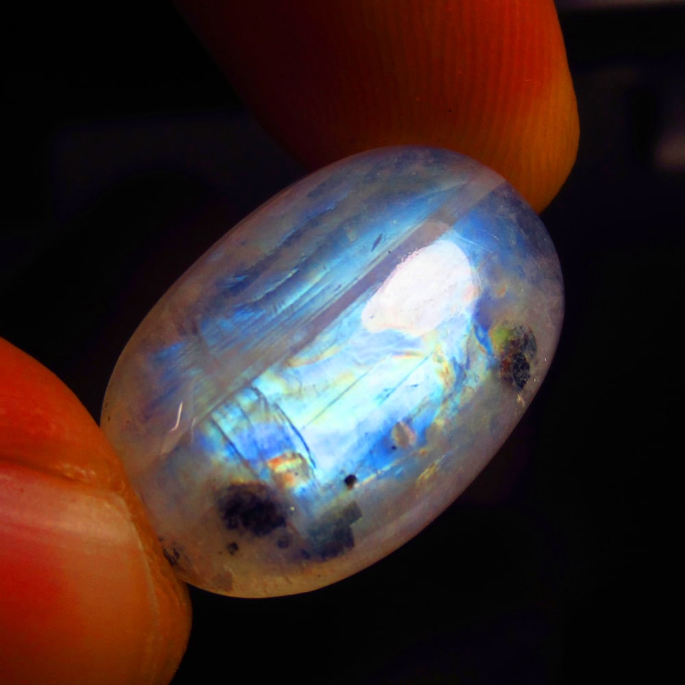 20.00 Ct Natural Blue Moonstone Loose Stone: Weight - 20.00 Ct / Size - 25.00 x 15.00 x 7.20 mm / Shape - Oval Cab / Clarity - Semi-Transparent / Origin - India / Treatment - None