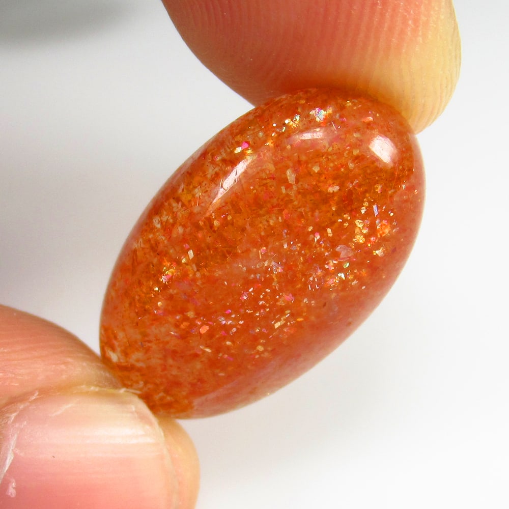 12.19 Ct Natural Sunstone Loose Stone: Weight - 12.19 Ct / Size -22.00 x 13.00 x 5.50 mm / Shape - Oval Cab / Clarity - Opaque / Origin - Brazil / Treatment - None