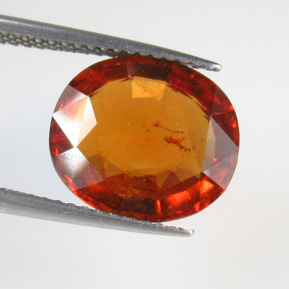 5.07 Ct Natural Hessonite Garnet Loose Stone: Weight - 5.07 Ct / Size - 12.10 x 10.20 x 4.80 mm / Shape - Oval Cut / Clarity - VVS / Origin - Nigeria / Treatment - None / Stock Id : N12311