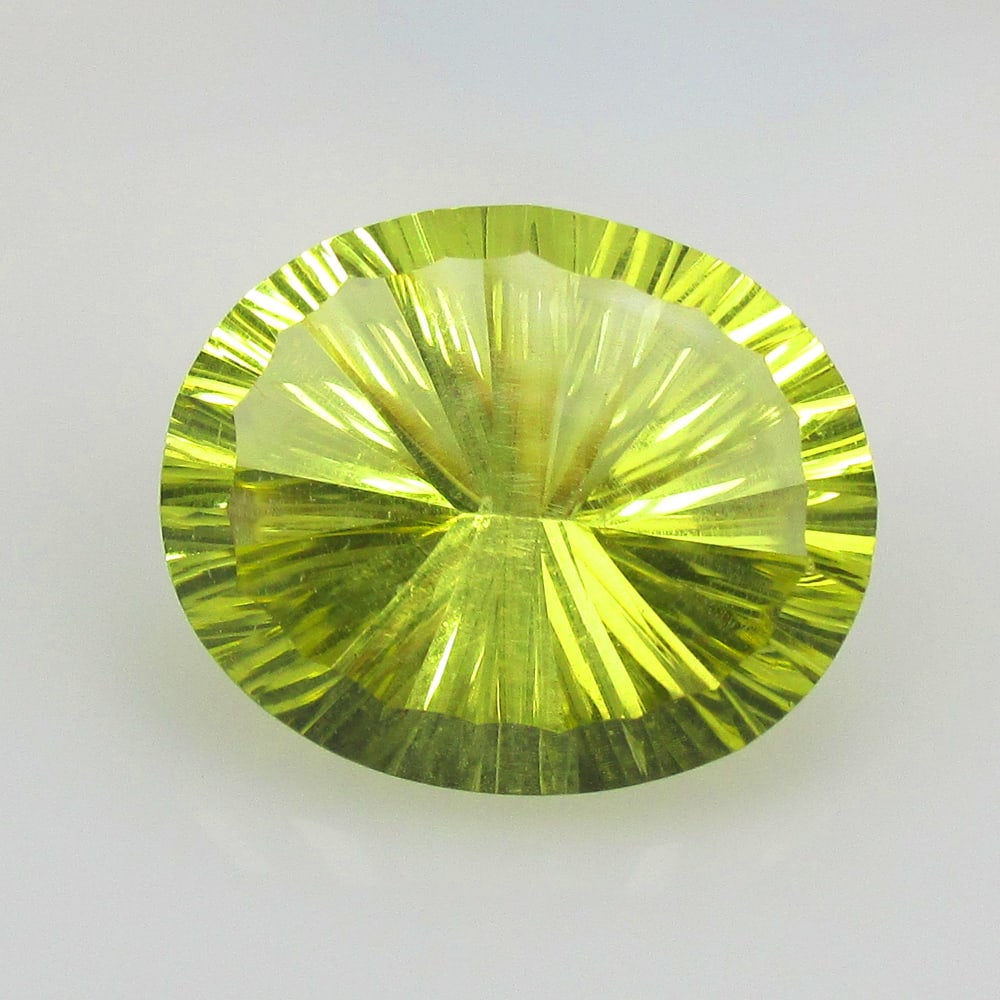 12.38 Ct Natural Lemon Quartz Loose Stone: Weight - 12.38 Ct / Size -17.70 x 14.60 x 9.30 mm / Top Quality Luster / Excellent Oval Concave Cut / Origin - Brazil / Treatment - None